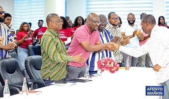 Bright Senanu (left), Lecturer, Political Marketing, UniMAC, presenting a citation to Alexander Kwamena Afenyo-Markin (right), Minority Leader and Member of Parliament for Effutu