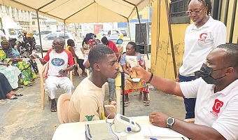 A nurse checking the vital statistics of a participant
