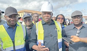 Governs Kwame Agbodza (right), Minister of Roads and Highways, addressing the press after inspecting the Bogoso-Prestea road. With him is Alhassan Suhuyini, his deputy