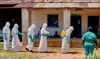Red Cross volunteers are conducting safe burials for Ebola victims to prevent the virus from spreading