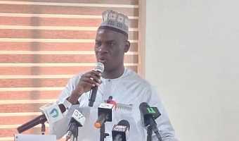 Haruna Iddrisu (left), Minister of Education, speaking at the swearing-in ceremony