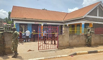 Worried parents gathered outside the school in Kampala after news of the attack spread