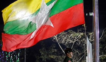 A Myanmar military soldier hoists a national flag during a ceremony to mark the 69th anniversary of Independence Day in Yangon, Myanmar, on Jan. 4, 2017. (AP Photo)