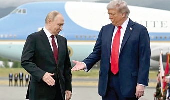 US President Donald Trump, right, reaches out to shake hands with Russian President Vladimir Putin.