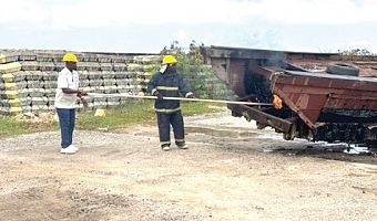 Godwin Edudzi Tamekloe (left), Chief Executive Officer of NPA, and a fire expert setting fire to the boats