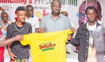 Nana Agyei Baffour Awuah (middle), MP for Manhyia South, with some constituents unveiling  a T-shirt for the Soloku festival at the launch