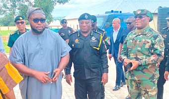 Salisu Be-Awuribe (left), Savannah Regional Minister, conducting COP Christian Tetteh Yohuno, IGP, and his team around