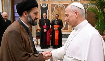 Pope Leo greets participants in the colloquium 