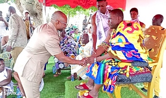 Francis Owusu Antwi (left), Bono East Regional Minister, exchanging pleasantries with Okofrobour Awasi Afuri, Dwanhene