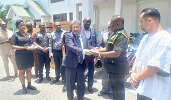 Mohammed Baakbaki, Lebanese Ambassador, handing over the keys to the vehicles to IGP Christian Tetteh Yohuno (2nd from right) while Mohammed Raii (right) looks on