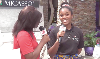 A staff member of Micasso (right) speaking about the company’s products at the fair