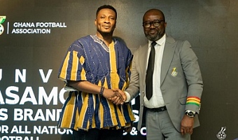 Asamoah Gyan with Mr Kurt Edwin Simeon-Okraku, GFA President