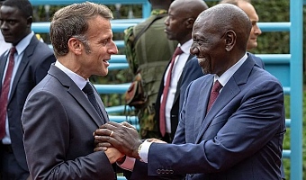The French president (L) is in Kenya, where he is co-hosting the Africa Forward Summit alongside his Kenyan counterpart (R)