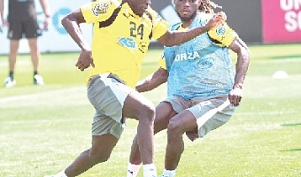 Gideon Mensah (right) training with teammate Ernest Nuamah at the team’s Cardiff base