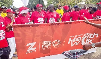 Henry Chinedu Onwuzurigbo (3rd from left), Managing Director, Zenith Bank, and Stephen Appiah (4th from left), former captain, Black Stars, in an interaction during the health walk. Picture: ERNEST KODZI 
