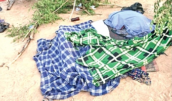 Covered bodies of some of the victims of the Volta Lake canoe disaster 