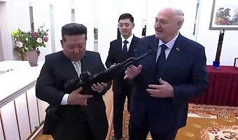 The rilfle is a gift 'just in case enemies appear', Lukashenko tells Kim