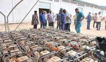 Eric Opoku (arrowed), Minister of Food and Agriculture, inspecting some of the water pumping machines to be distributed 