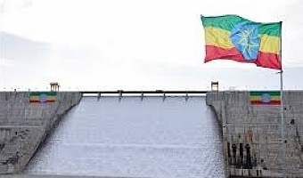   An Ethiopian flag flutters in the wind next to the Grand Ethiopian Renaissance Dam (GERD), built along the Blue Nile, during its inauguration, in Guba, Benishangul-Gumuz region, Ethiopia, September 9, 2025