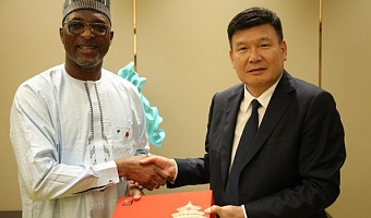 Interior Minister, Mr Muntaka Mohammed-Mubarak, in a handshake with China’s Vice Minister of Public Security, Mr Ling Zhifeng, after bilateral talks in Beijing