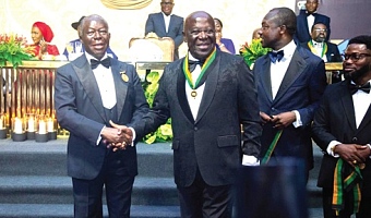Otumfuo (left) congratulates Sir Sam Jonah