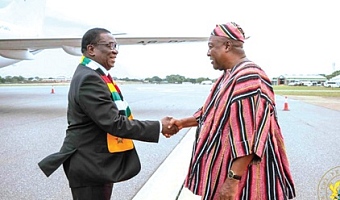 President Mahama (right) welcoming President Emmerson Dambudzo of Zimbabwe, at the Accra International Airport 