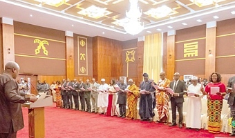 President Mahama (left) administering the oath of office to the new envoys