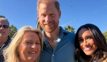 Narelle Zagami, a local resident, smiling with Harry and Meghan during the Scar Tree Walk in Melbourne.