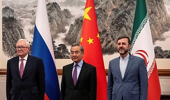 CHINESE FOREIGN MINISTER Wang Yi is flanked by Russian Deputy Foreign Minister Sergey Ryabkov (left) and Iranian Deputy Foreign Minister Kazem Gharibabadi at a meeting on the Iranian nuclear issue in Beijing in March.