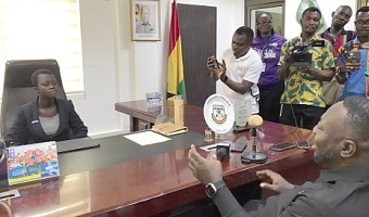 George Opare Addo (back facing camera), Minister of Youth Development and Empowerment, addressing Beatrice Laari Dammigu, the speaker of the West Mamprusi Municipality Children's Parliament, during the takeover activity to mark International Day of the Girl Child. Picture: ESTHER ADJORKOR ADJEI