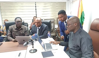 Dr Cassiel Ato Forson (right), Minister of Finance, being aided to file his tax returns. With him are Martin Kolbil Yamborigya (left), Commissioner, Domestic Tax Division, Ghana Revenue Authority, and Thomas Nyarko Ampem (2nd from left), Deputy Minister of Finance