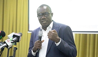 Moses Okley (right), Finance Manager of ECG, addressing the audience at the event. Picture: CALEB VANDERPUYE