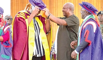President Mahama decorating Ibrahim Mahama with a doctoral hat