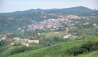 Amedzofe as seen from the peak of Mount Gemi (inset)