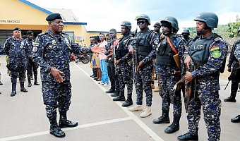 IGP Christian Tetteh Yohuno (left) addressing the Special Operations Team in Damongo