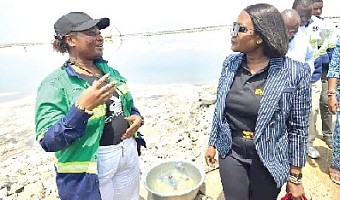 •Mrs Nelson interacting with a female worker at Electrochem during her official tour of the company's salt production site
