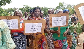 Women with their placards with messages about peace during the walk