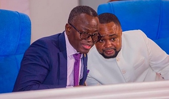 Justice Emmanuel Yonny Kulendi (left), a Justice of the Supreme Court, having a tete-tete with Wonder Victor Kutor, author of the book, at the launch 
