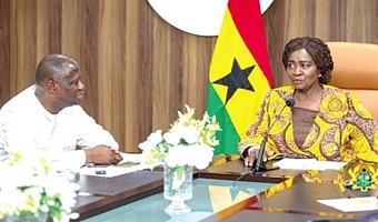Prof. Naana Jane Opoku-Agyemang, Vice-President, engaging Emmanuel Armah-Kofi Buah (left), Minister of Lands and Natural Resources, during her visit to the ministry