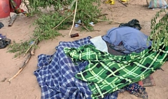 Bodies of some of the victims of the Volta Lake canoe disaster lie covered as community members prepare for their burial in line with Islamic customs.