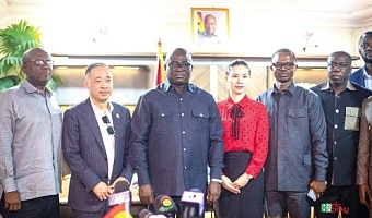 Eric Opoku (3rd from left), Minister of Food and Agriculture, and Ningquan Xu, Group Chairman of Sentuo Group, with officials of the ministry and the group