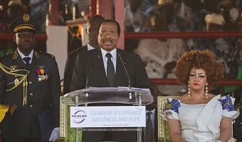 Cameroon's 92-year-old president, Paul Biya, speaks next to his wife Chantal Biya, during the launch of his electoral campaign, in Maroua, Cameroon, October 7, 2025. DESIRE DANGA ESSIGUE / REUTERS