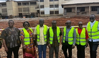 Emmanuel Kwasi Bedzrah(middle), Board Chairman of Ghana Education Trust Fund with other board executives at the site of the collapsed building.