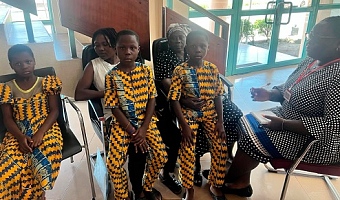 Louisa Kukua Barnes (right), our reporter,  with Peter, Paul and Pearl, the triplets; their grandmother (in scarf) and aunty