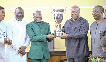 Alban Sumana Kingsford Bagbin (3rd from left), Speaker of Parliament, presenting the Democracy Cup to President John Dramani Mahama (2nd from right). With them are some dignitaries