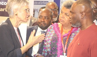 Jolanda Castagna (left), Managing Director of akka kappa Ltd., explains a point to Kenneth Gibert Adjei (right), Minister for Works, Housing, and Water Resources; Gizella Tetteh-Agbotui (2nd from right), Deputy Minister for Works, Housing, and Water Resources; and Emmanuel Jeffrey (3rd from right), Acting Chief Executive Officer of the Real Estate Agency Council (REAC) during the opening of the exhibition at the conference. Picture: ESTHER ADJORKOR ADJEI