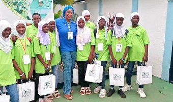 Hajia Memuna (arrowed) with some pupils after a free ICT training programme organised during their vacation.
