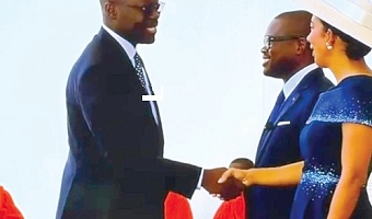Dr Cassiel Ato Forson, Minister of Finance,  congratulating Romuald Wadagni, Benin President