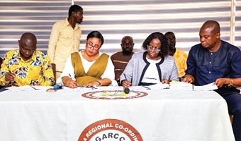 Linda Akweley Ocloo (2nd from left), Greater Accra Regional Minister, together with Samuel Tetteh Quarshie Morton (left), Municipal Chief Executive, Kpone Katamanso Municipal Assembly, and the members of the Greater Accra Regional Coordinating Council signing the performance contract. Picture: ELVIS NII NOI DOWUONA 