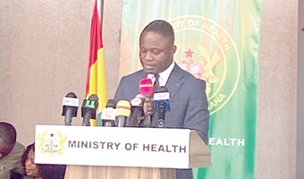 Kwabena Mintah Akandoh (left), Minister of Health, administering the oath to members of the board